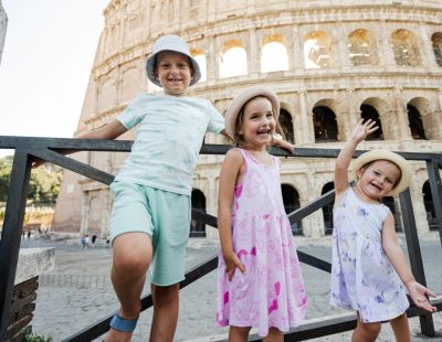 Three,Funny,Kids,Against,Colosseum,In,The,Old,City,Center